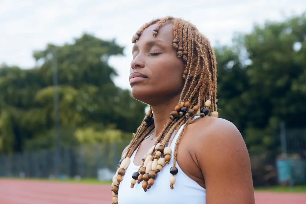 Woman with braids recovering from food fixation and finding healing.