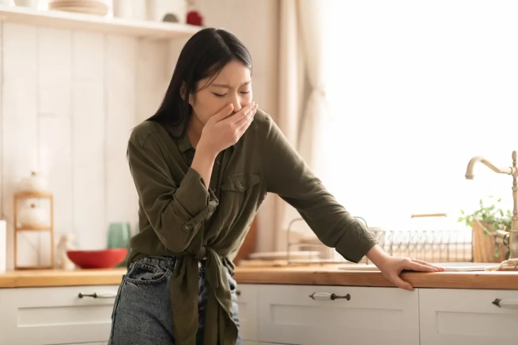 Woman struggling with fear foods​ in the kitchen.